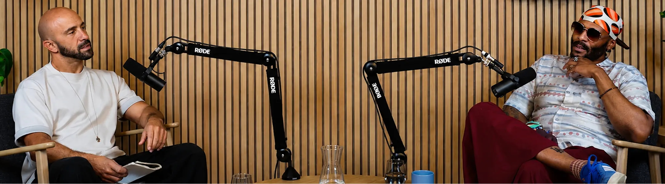 Human Journeys podcast studio with hosts and microphones
